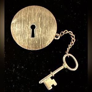 Vintage 1970's M Jent brushed gold round brooch with keyhole and attached key